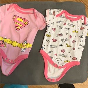 2 supergirl baby onesies